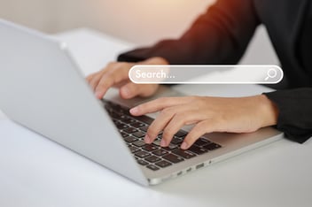 Woman using laptop searching information online